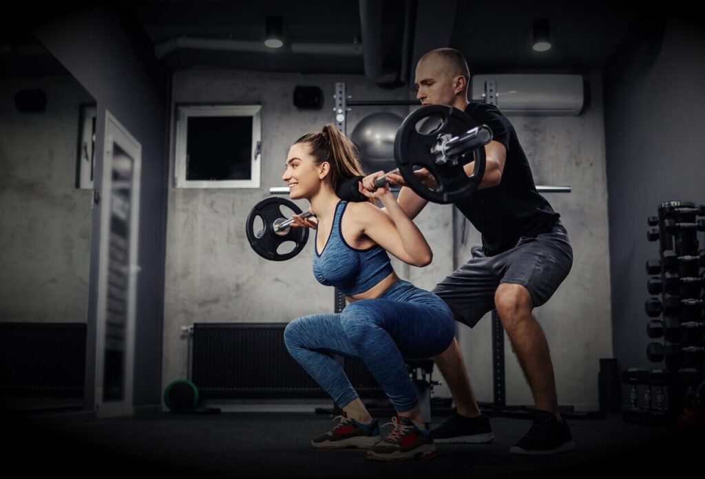 Barbell workout with personal trainer